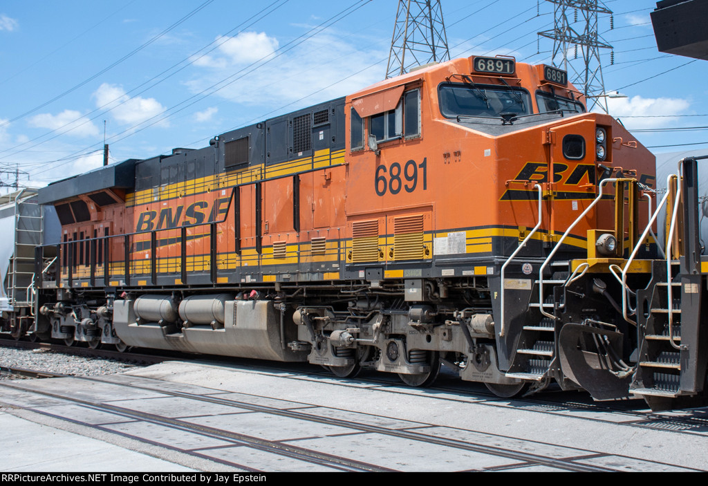 BNSF 6891 trails on a train departing PTRA's North Yard